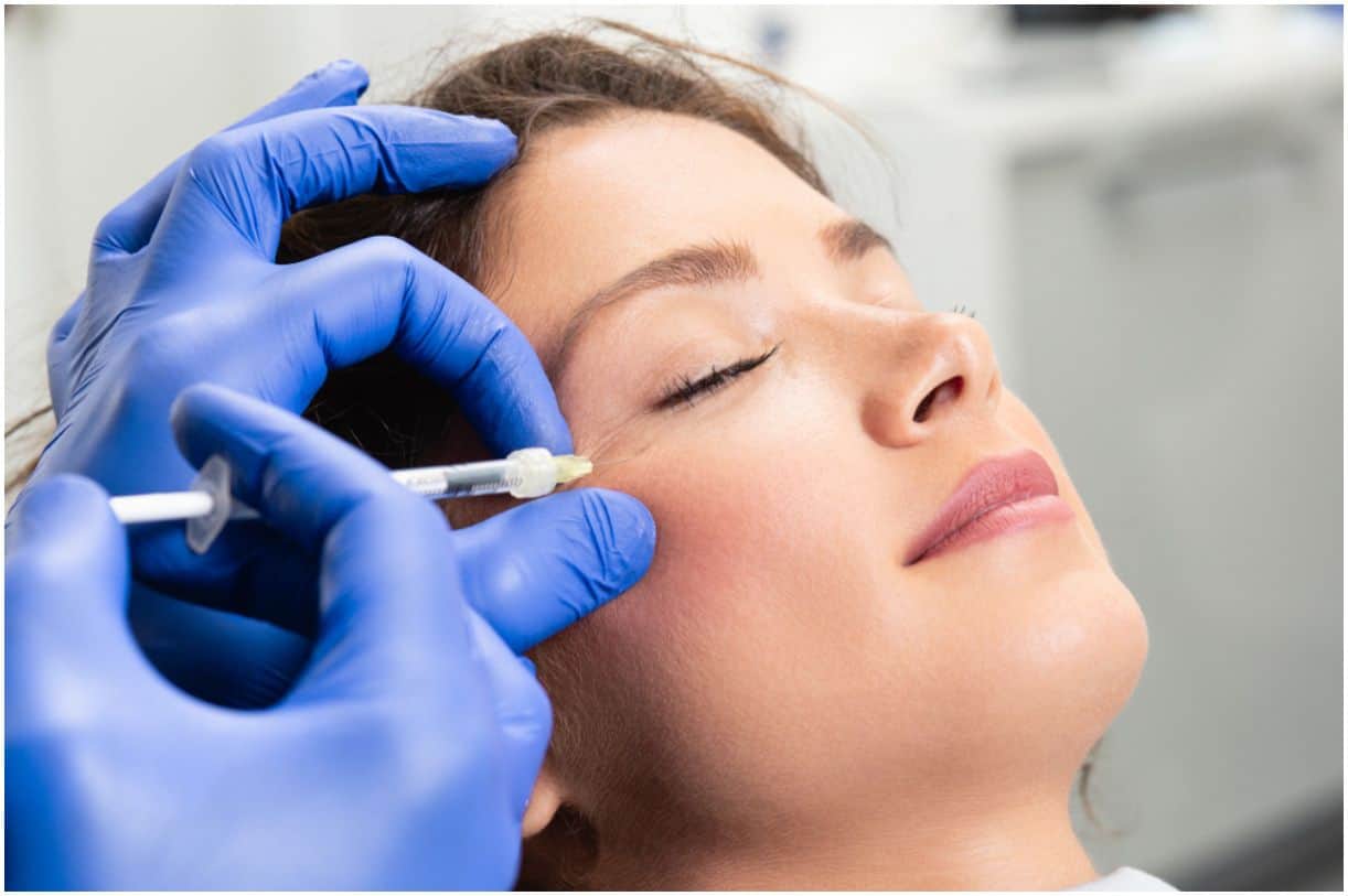 young woman is getting a rejuvenating facial injections