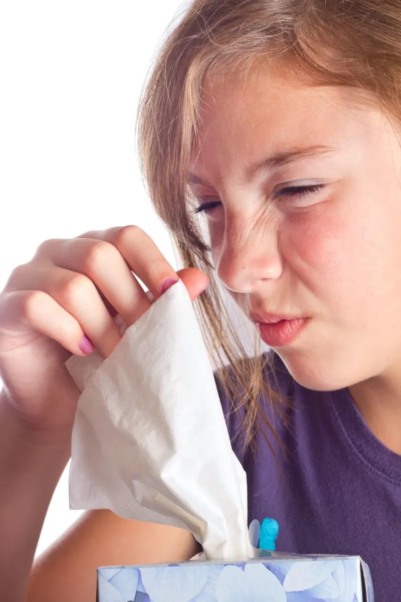 4 Reasons Why Your Sneeze Smells & What It Means For Your Health